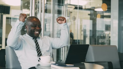 A business owner reacting with excitement to their results